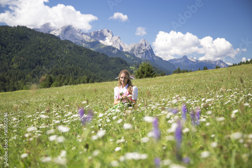 A girl in typical dress into the alpine landscape of GErold, Garmisch Partenkirchen Land, Bayern, Germany photo