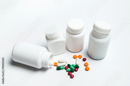 Medicine bottle and medicine on a white background