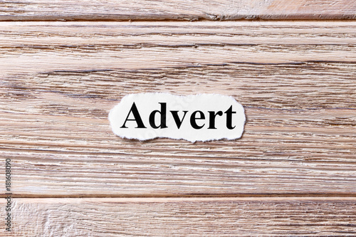 Advert of the word on paper. concept. Words of Advert on a wooden background