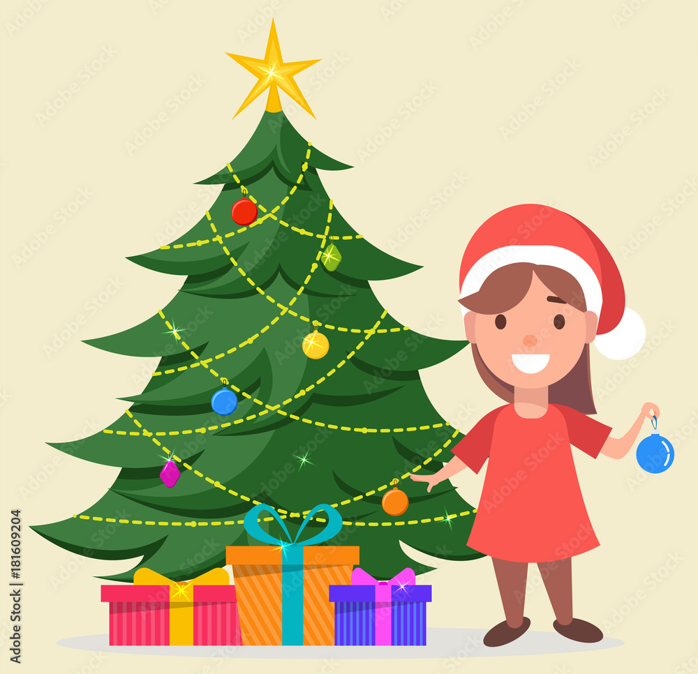 Girl in Santa Claus hat standing near decorated Christmas tree with gift boxes under it Girl in Santa Claus hat standing near decorated Christmas tree with gift boxes under it