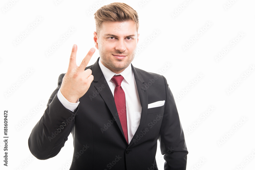 Portrait of handsome corporate business man showing number two Portrait of handsome corporate business man showing number two