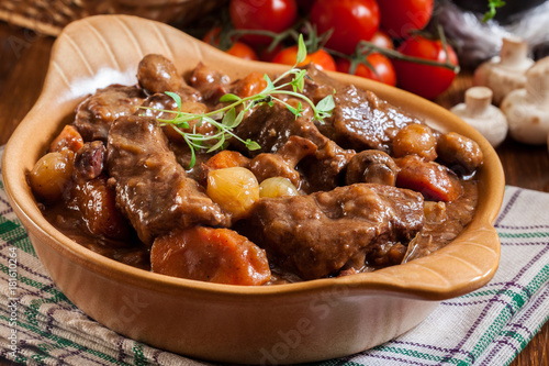 Fototapeta Beef Bourguignon stew served with baguette