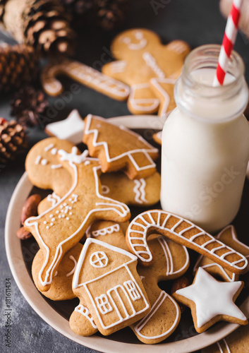 Milk and cookies. Gingerbread  cookies on a gray background.  Christmas cookies.  Ginger men