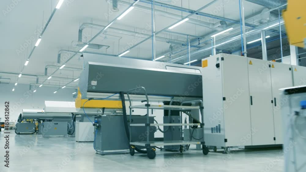 Moving Walkthrough Shot of the High-Tech Modern Electronics Manufacturing Factory Full of Computerized Automatic Machinery. Facility is Bright and Clean. Moving Walkthrough Shot of the High-Tech Modern Electronics Manufacturing Factory Full of Computerized Automatic Machinery. Facility is Bright and Clean.