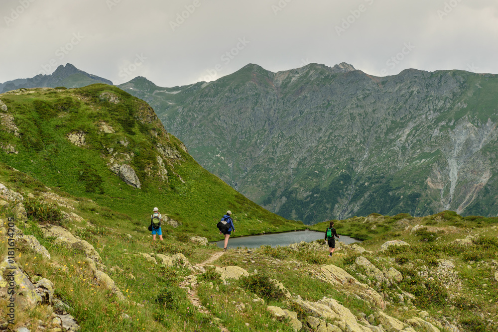 Tourists near mountain lake, Abkhazia