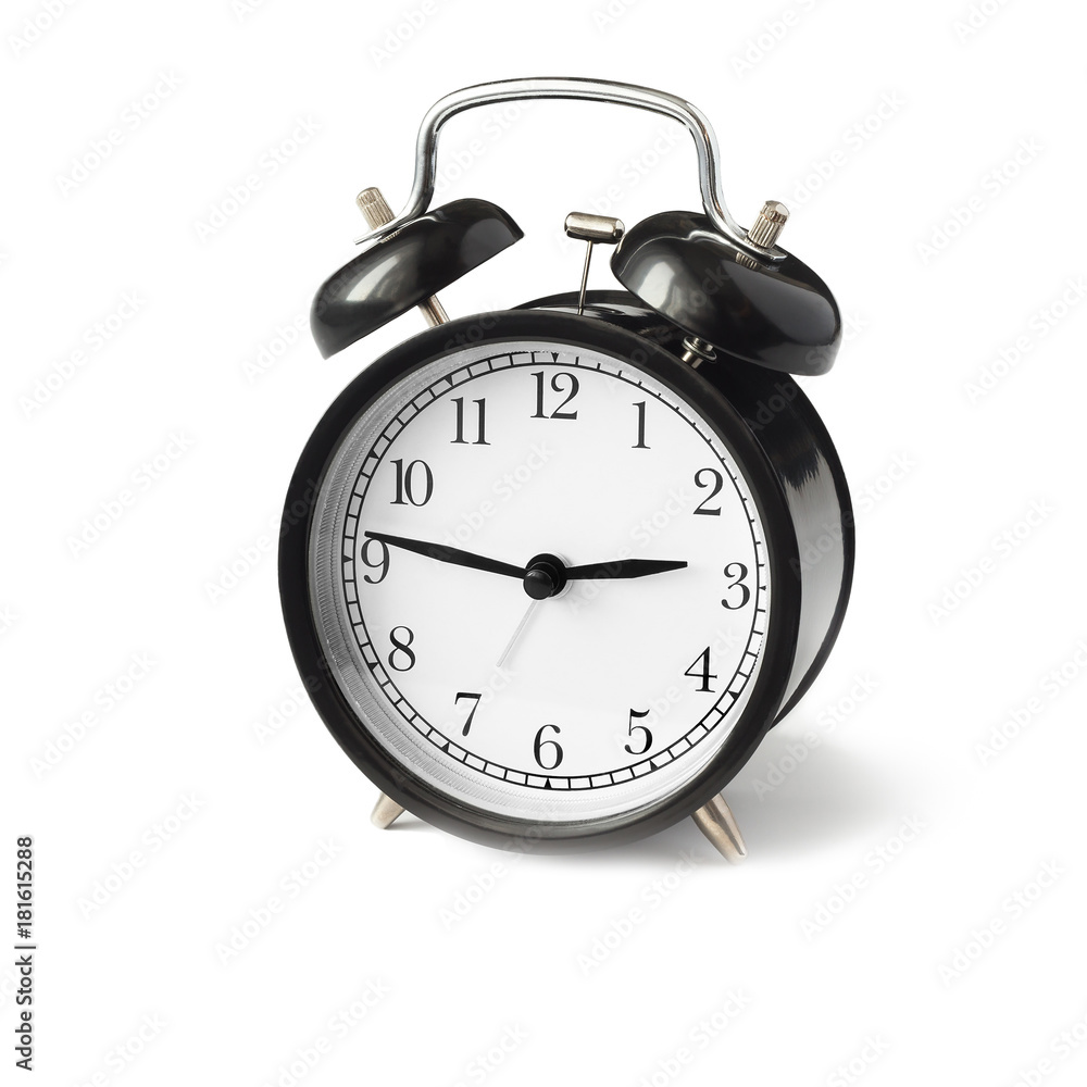 black alarm clock with white dial side view. black alarm clock with white dial side view.