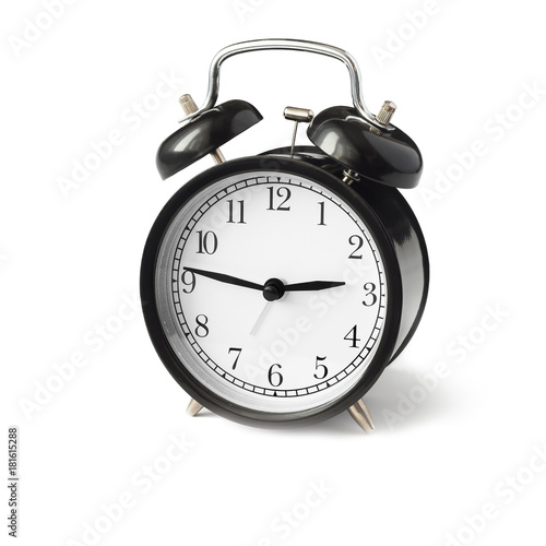 black alarm clock with white dial side view.