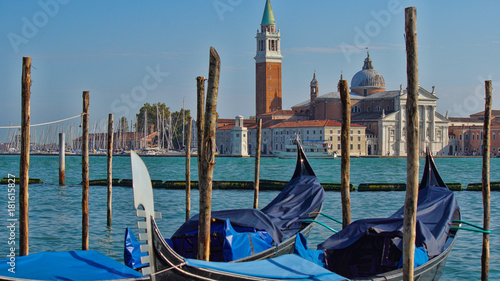 Gondola boats parking. Gondola moored, Venice, Italy. Italian gondola paddle boats docked in Venice, Veneto, Italy.