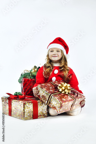 Little girl red dress santa hat with gift on white background