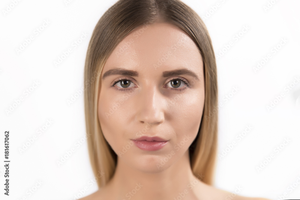 Beautiful face of young adult woman with clean fresh skin - isolated on white Beautiful face of young adult woman with clean fresh skin - isolated on white