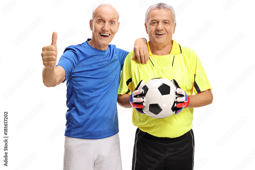 Elderly soccer player making a thumb up gesture and a goalkeeper with a football