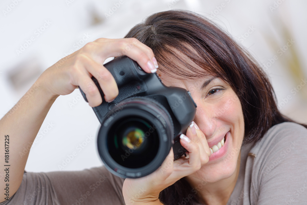 Portrait of woman taking photograph Portrait of woman taking photograph