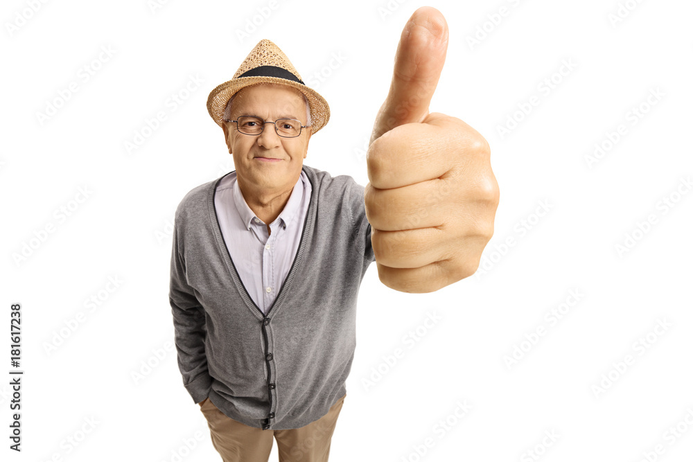 Mature man making a thumb up gesture Mature man making a thumb up gesture