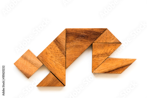 Wood tangram puzzle in man that squat or worship shape on white background