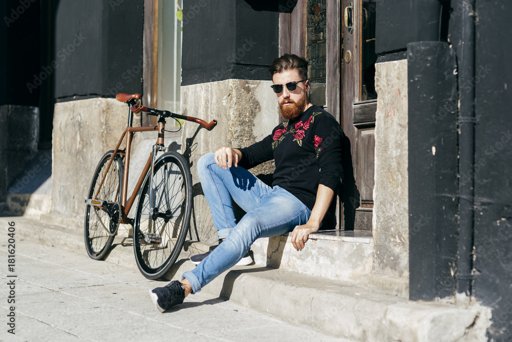 Stylish man with bicycle on street Stylish man with bicycle on street