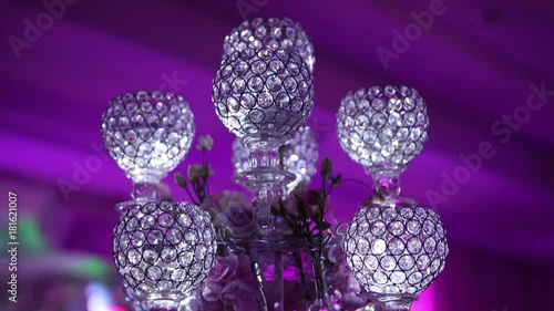 wedding decorations, white wax candleswith glass candlestick, party background, restaurant, interior, close-up photo