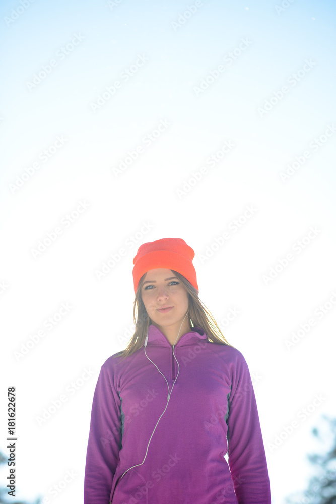 Young Woman Runner in Beautiful Winter Forest at Sunny Frosty Day. Active Lifestyle and Sport Concept. Young Woman Runner in Beautiful Winter Forest at Sunny Frosty Day. Active Lifestyle and Sport Concept.