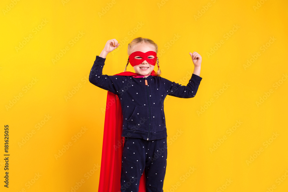 Superhero little girl in a red raincoat and a mask Superhero little girl in a red raincoat and a mask
