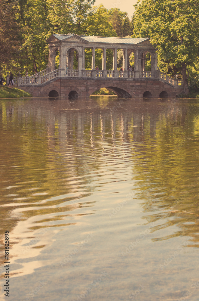 Petersburg, Russia - June 29, 2017: Marble Bridge in the park Tsarskoye Selo, Russia. Petersburg, Russia - June 29, 2017: Marble Bridge in the park Tsarskoye Selo, Russia.