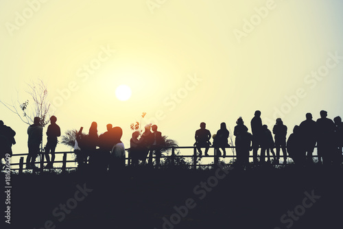 asians travel relax in the holiday.People stand looking at the sun in the morning. Stand up for sunrise on the Moutain © last19
