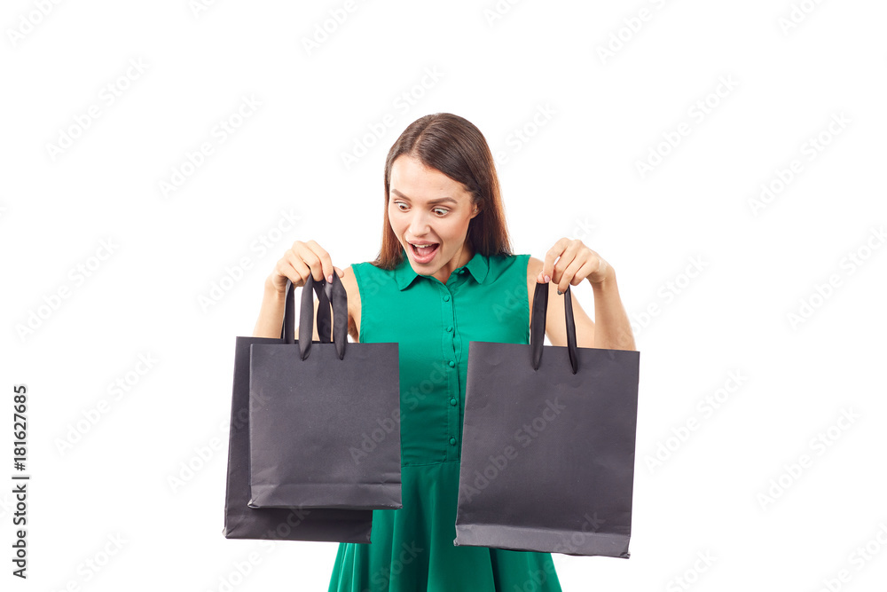 Portrait of female shopaholic holding black shopping bags Portrait of female shopaholic holding black shopping bags