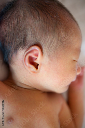 Sleeping Asian newborn