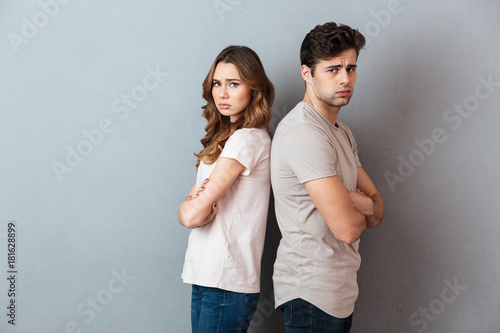 Fotografie Portrait of an upset couple standing back to back