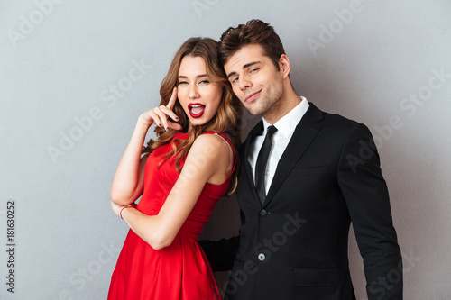 Portrait of a beautiful young couple dressed in formal wear photo