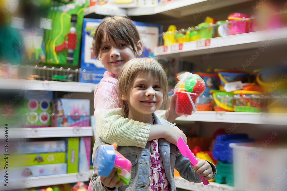 Two sisters in toy store Two sisters in toy store