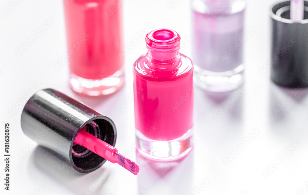 Bottles with nail polish over white background mockup Bottles with nail polish over white background mockup