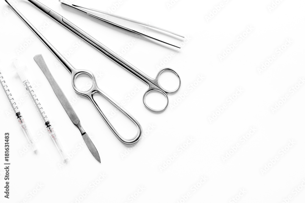 instruments for plastic surgery on white background top view instruments for plastic surgery on white background top view