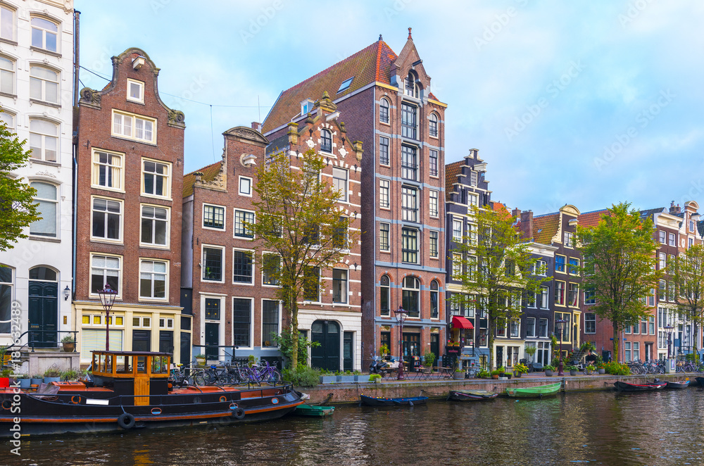 Amsterdam City Center. Beautiful view of Amsterdam Canals and typical Dutch Houses. Amsterdam, Netherlands. .