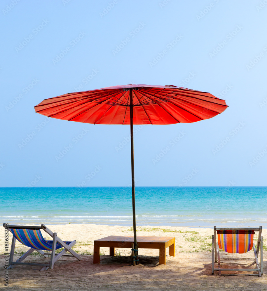 Fototapeta premium Beach chair and red umbrella on the beach ,Trat Province Thailand
