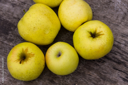 Ripe green apples on rustic wooden table