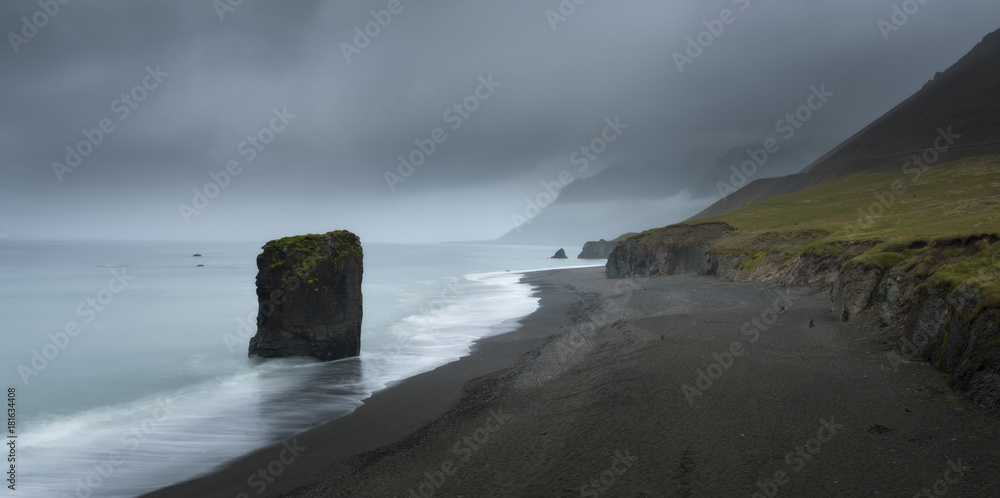 Typical Icelandic seascape with black basalt sand