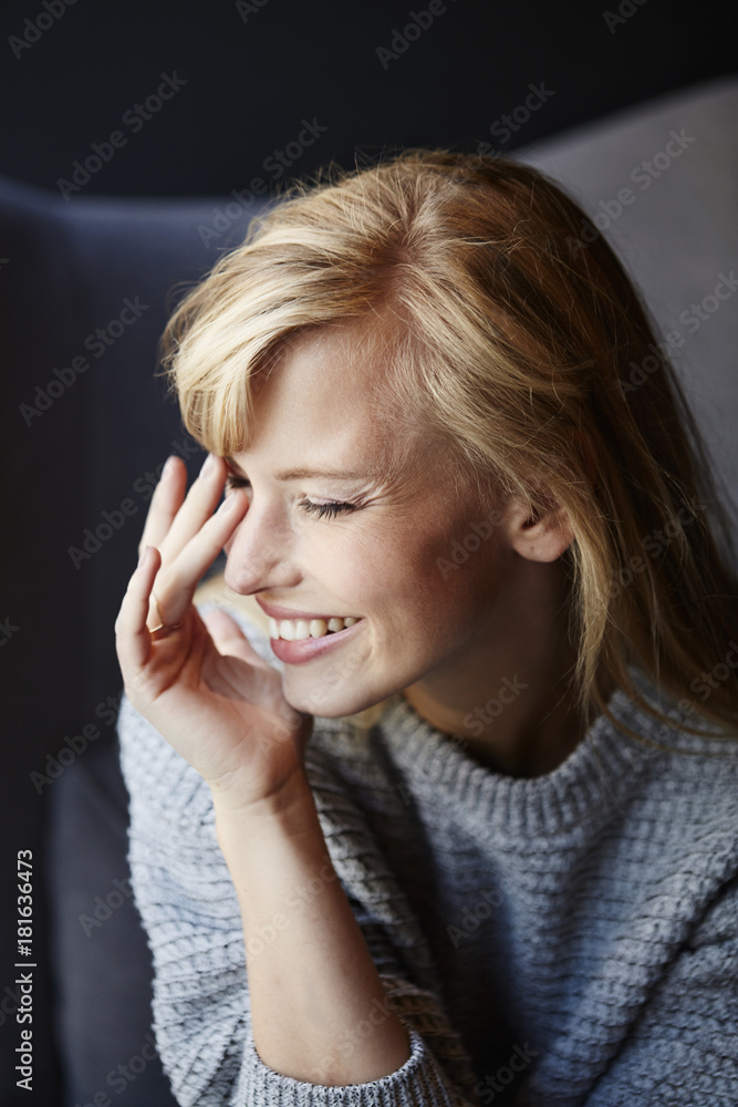 Laughing young blond lady in cafe Laughing young blond lady in cafe