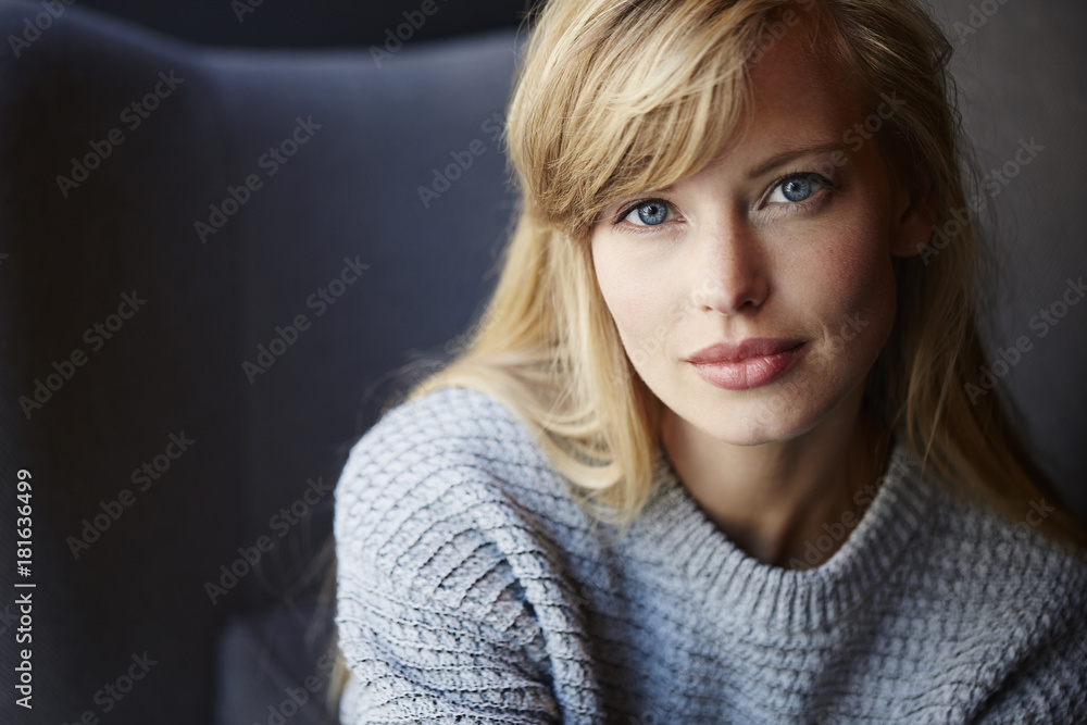 Stunning blue eyed blond woman looking to camera Stunning blue eyed blond woman looking to camera