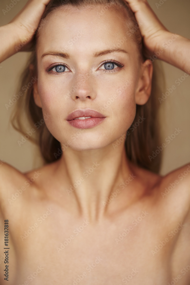 Beautiful young woman with blue eyes looking at camera Beautiful young woman with blue eyes looking at camera