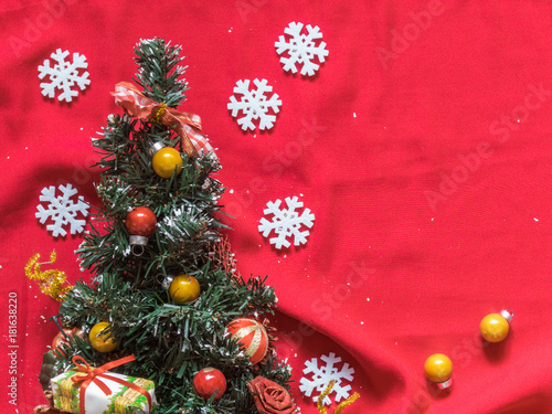 Christmas tree  white snowflakes  Christmas balls on a red background. Christmas background. Free space for text. Top view