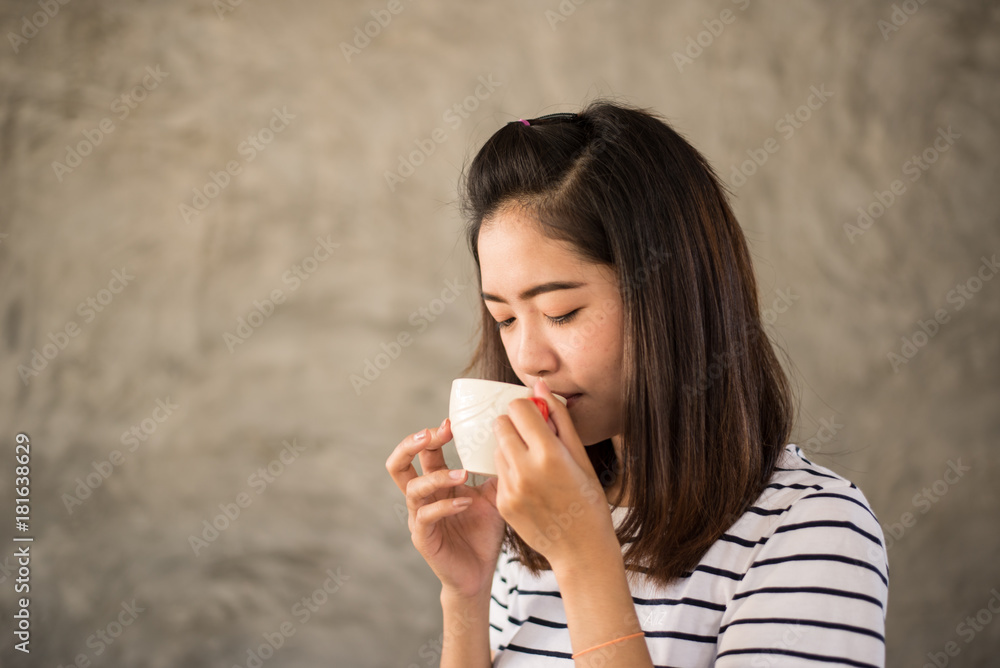 Portrait of asian girl drinking hot coffee Portrait of asian girl drinking hot coffee