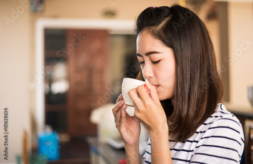 Portrait of asian girl drinking hot coffee