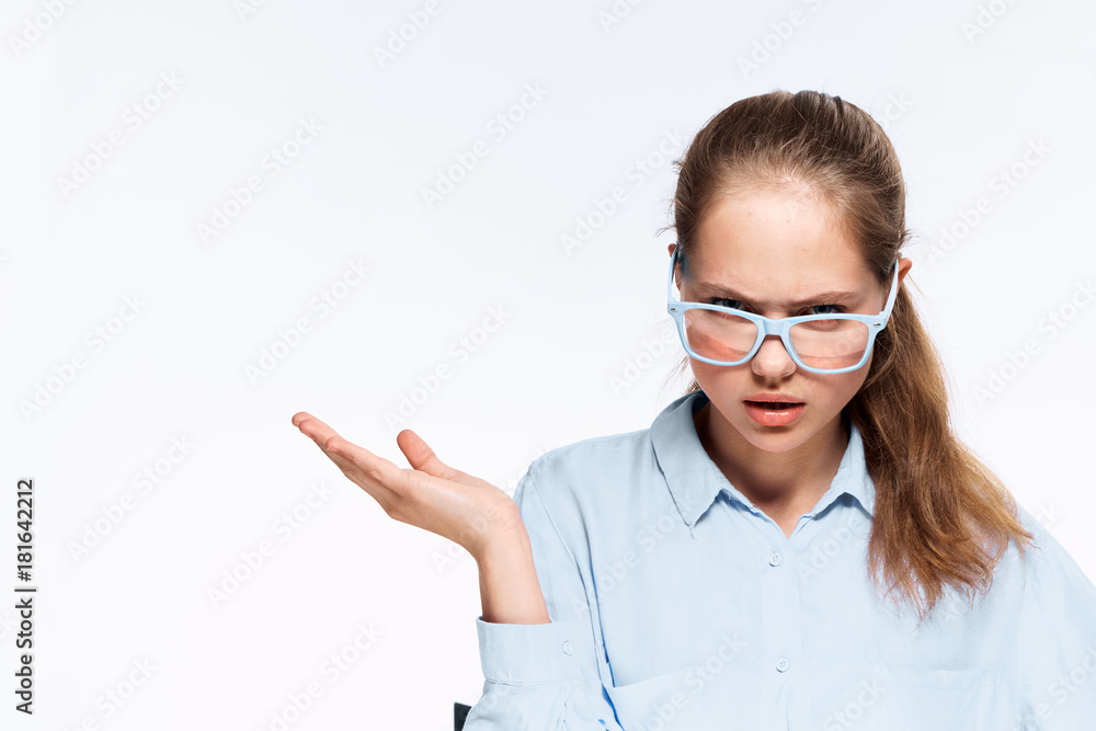 Beautiful young woman on white isolated background shows on empty space Beautiful young woman on white isolated background shows on empty space