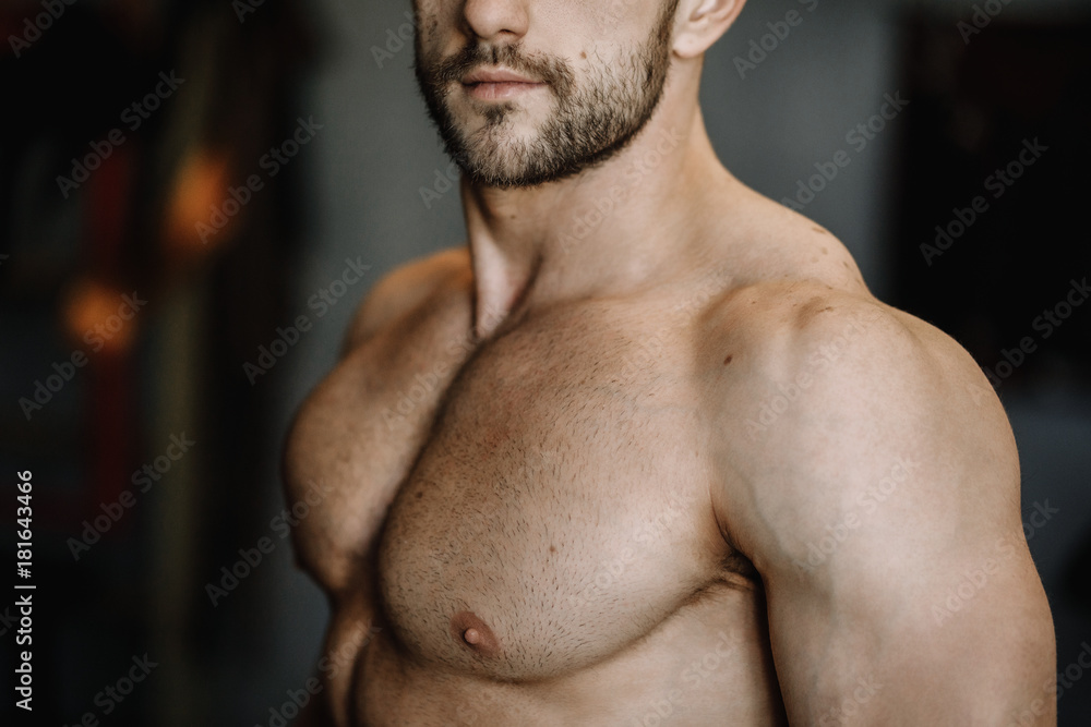 Muscular man working out in gym Muscular man working out in gym