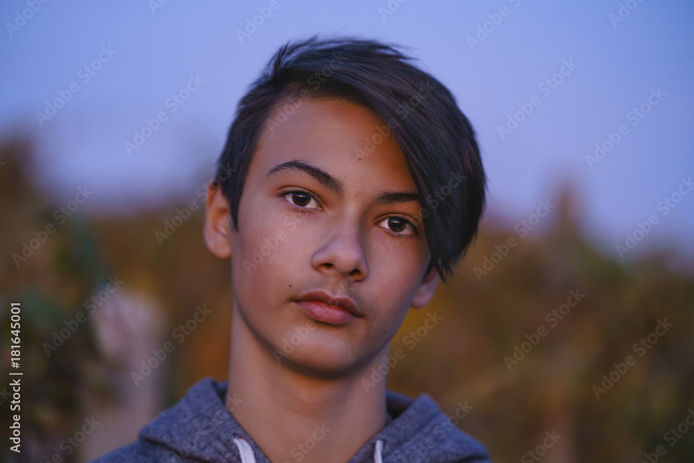 portrait with an Asian young man at sunset portrait with an Asian young man at sunset