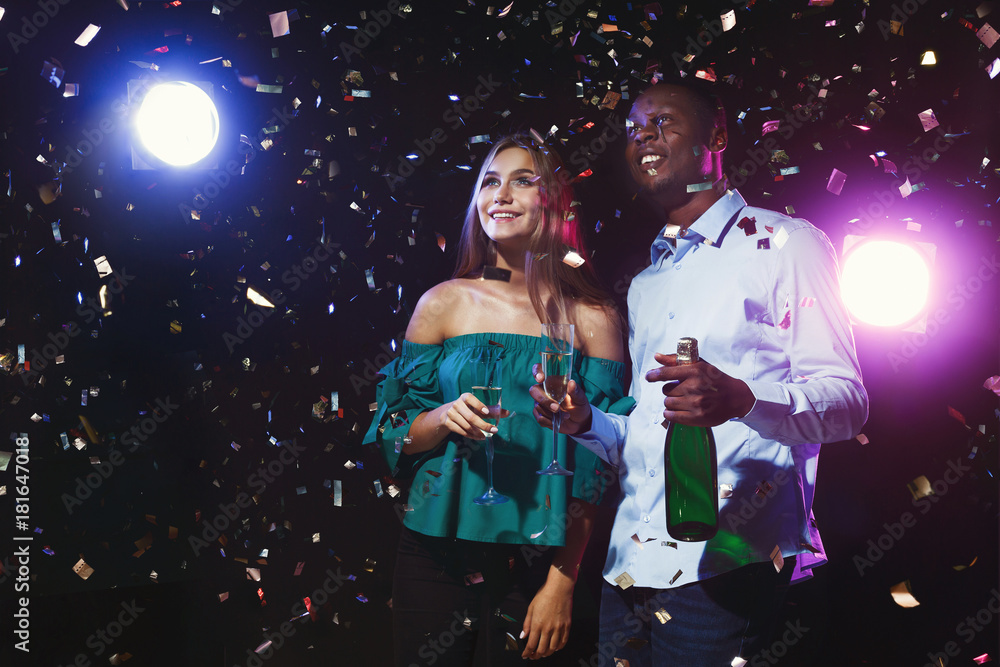 Happy friends with champagne flutes at night club party Happy friends with champagne flutes at night club party