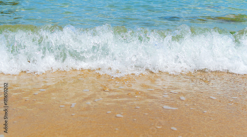 Soft Wave Of Blue Ocean On Sandy Beach. Background. Selective focus