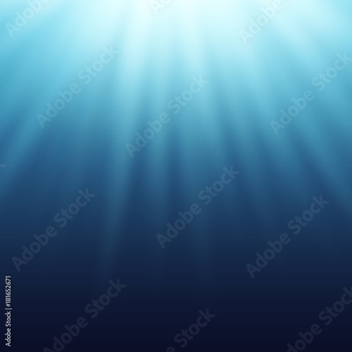 Light effect, sun rays, beams shining true the blue water.