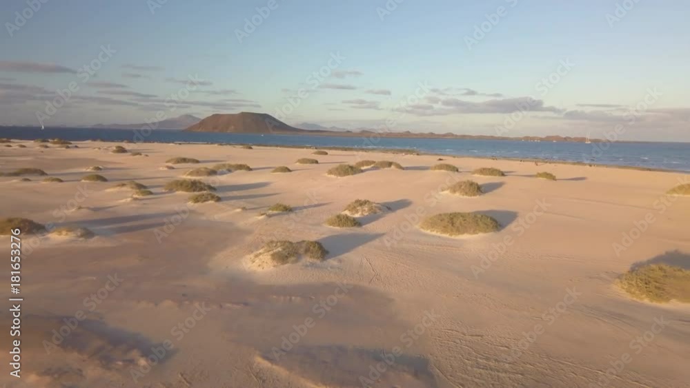 aerial view of beach with lobos island in background aerial view of beach with lobos island in background