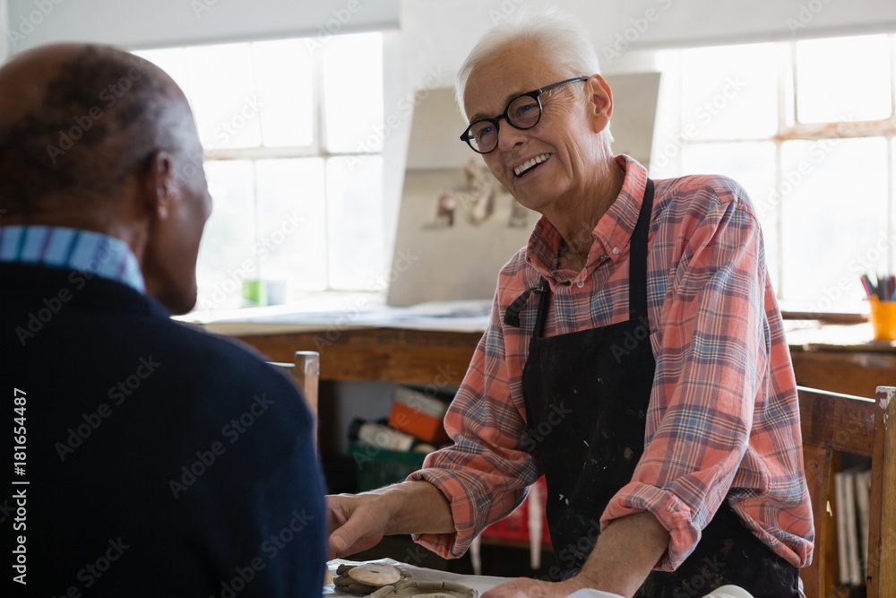 Smiling man looking at male artist Smiling man looking at male artist