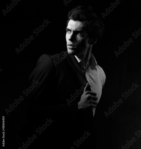 Photography Fashion sexy expression charismatic man looking on copy space dark shadow dramatic light background